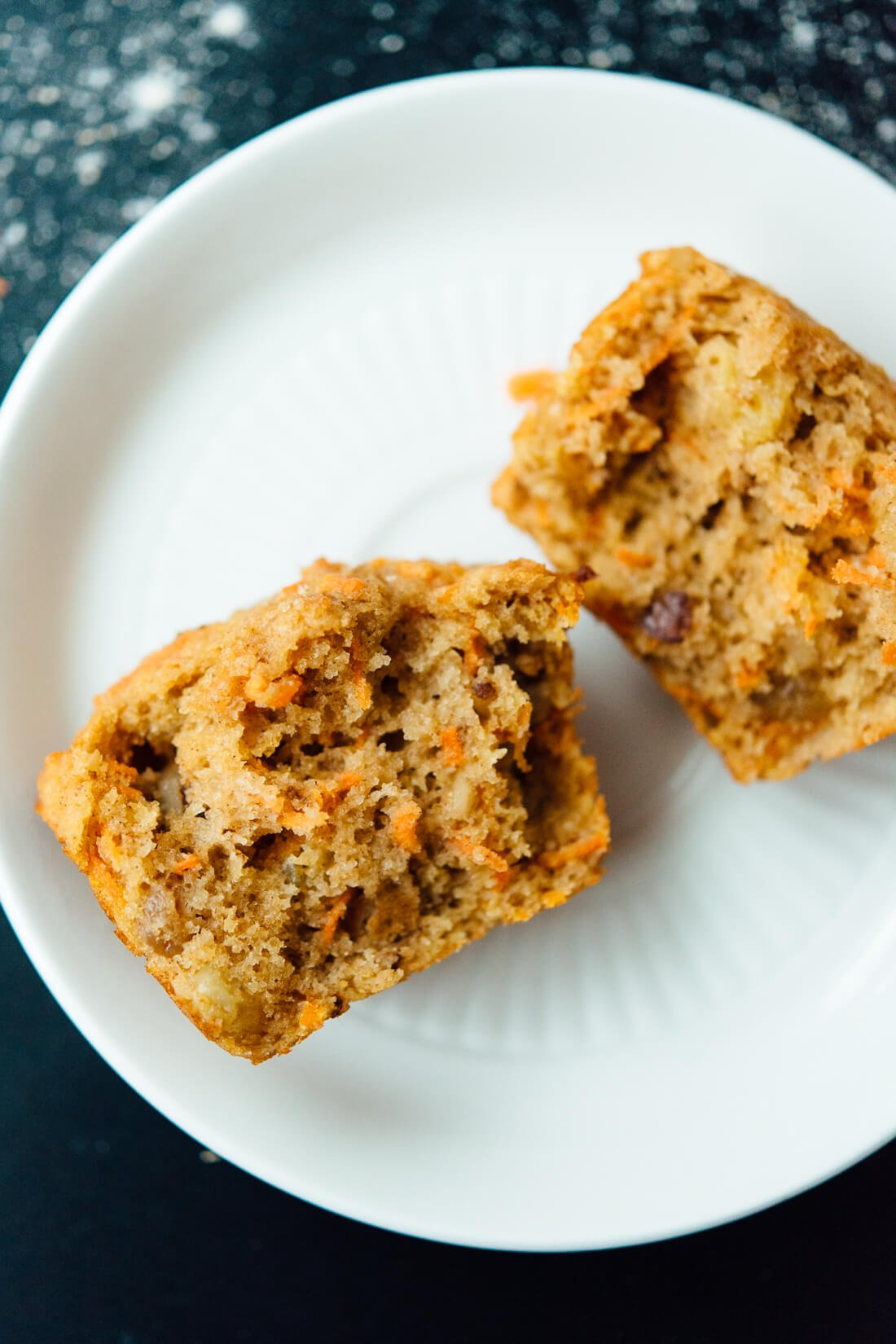 Healthy carrot muffins that taste amazing! These are made with whole wheat flour and sweetened with maple syrup!
