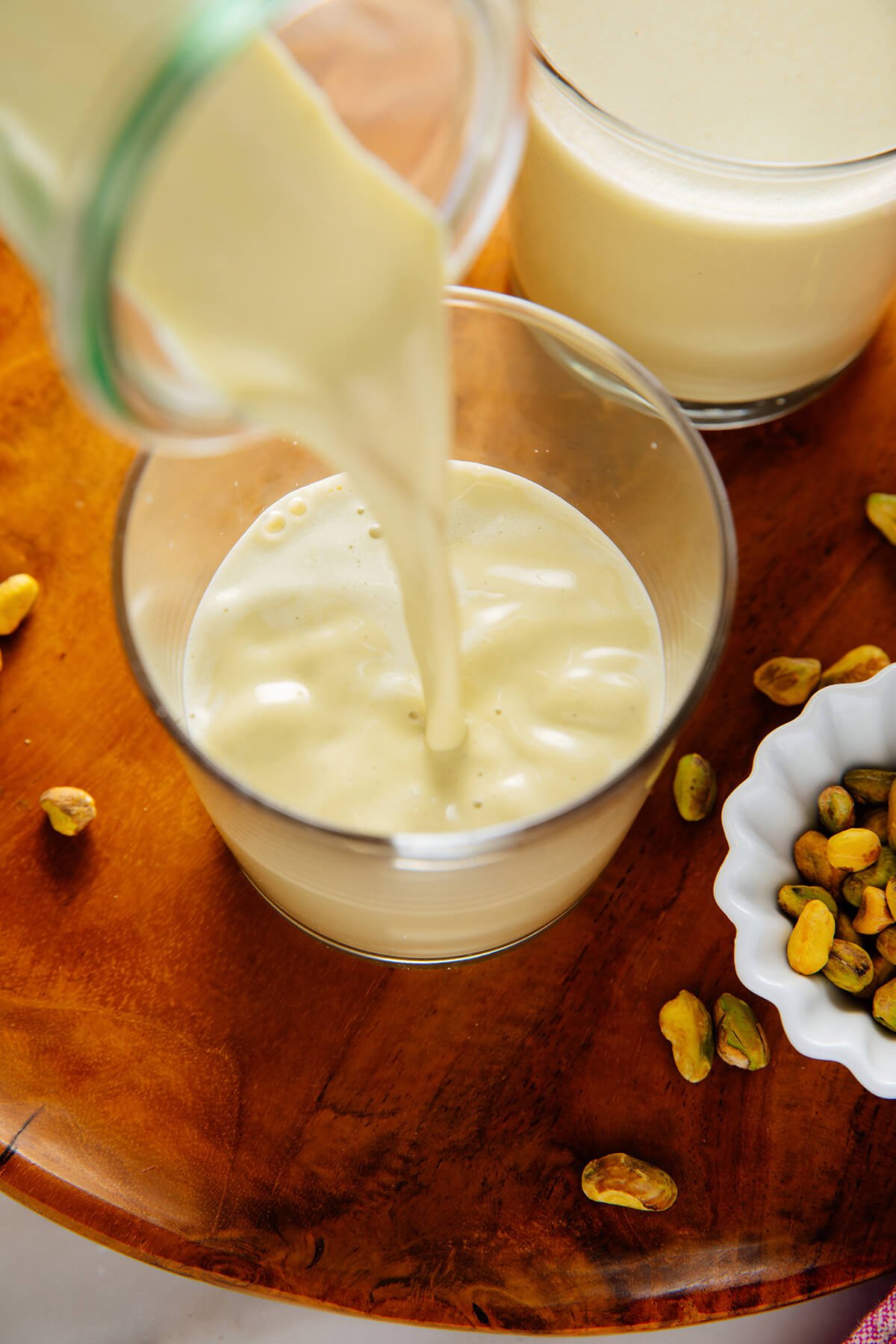pouring pistachio milk