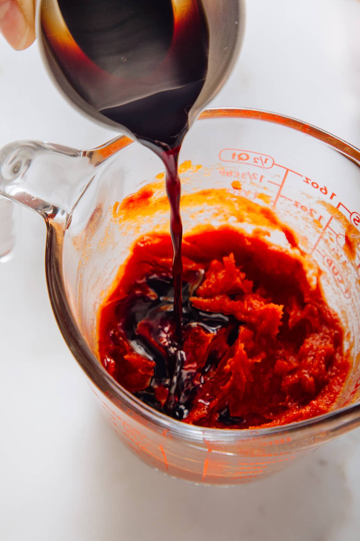 pouring vinegar into ketchup